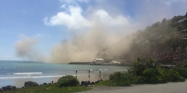 Damage from yesterday's earthquake in Christchurch. The dust cloud pictured resulted from a cliff collapse near Sumner. Photo / Andrew Watson