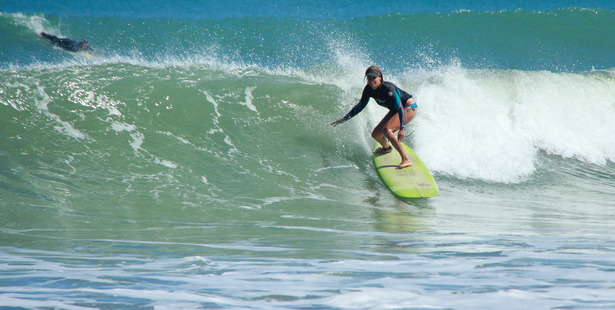 Surfer and Unitec osteopathy student Debbie Remnant has begun a research project to gain a better understanding of the physical toll of surfing in New Zealand. Photo / Jwan Milek