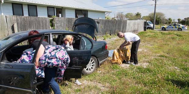 Police order squatters to leave one of the few houses left standing the red-zone area of Christchurch. Photo / Mike Scott