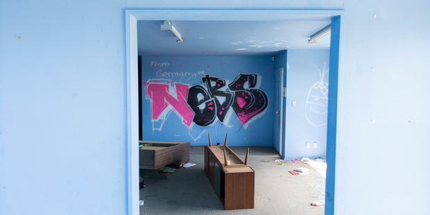 Graffiti covers the walls of condemned homes. Photo / Mike Scott