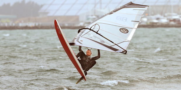A windsurfer makes the most of the windy conditions off Kulim Park. Photo / John Borren