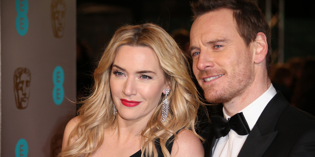 Kate Winslet and Michael Fassbender pose for photographers upon arrival at the BAFTA 2016 film awards at the Royal Opera House in London. Photo / AP