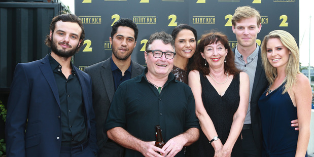 Writers Gavin Strawhan and Rachel Lang with the Filthy Rich cast. Photo / Norrie Montgomery