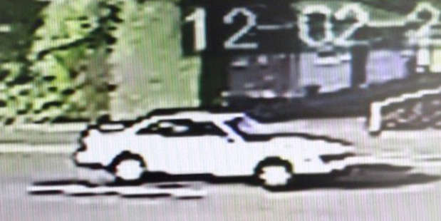 CCTV security video still of a white car on Shamrock St believed to have been driven by a man who tried to abduct a five-year-old girl. Photo / Supplied