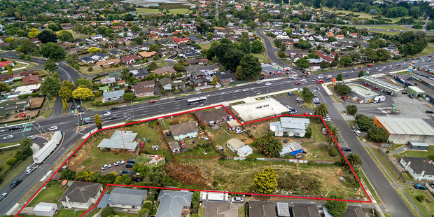 An elevated view of the 7234 sq m development site in Takanini with seven titles identified by red borders.