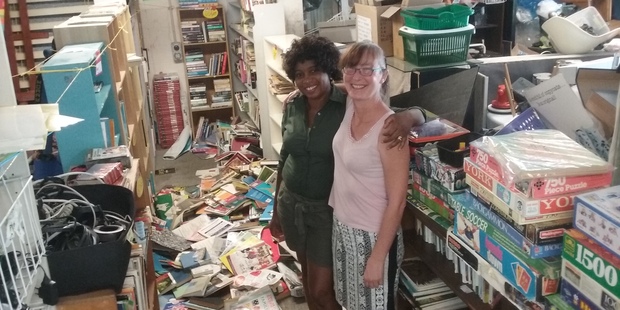Ladi Samuel (left) and Patricia Vujcich with the mess left at 2nd Traders after yesterday's quake. Photo / Kurt Bayer