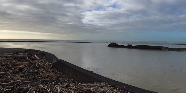 The boat tipped over while crossing the Waitara river bar. Photo / Jim Tucker