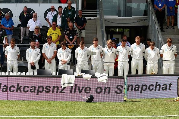 Players pay tribute to the Christchurch earthquakes wearing black arm bands. Photo / Getty