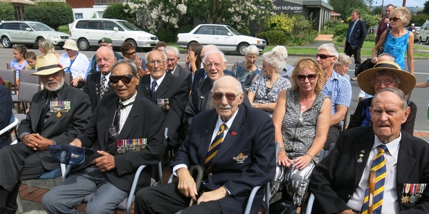 The New Zealand flag is lowered for the final time at Te Puke RSA. Te Puke RSA members and war veterans, from right, Peter Reekie, Doug Brown and Dave Ransfield at the ceremony. Photo / Pauline Carney
