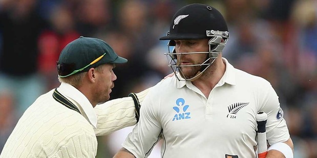 Brendon McCullum of New Zealand is congraulated by David Warner of Australia as he walks from the ground after his final test innings. Photo / Getty Images.