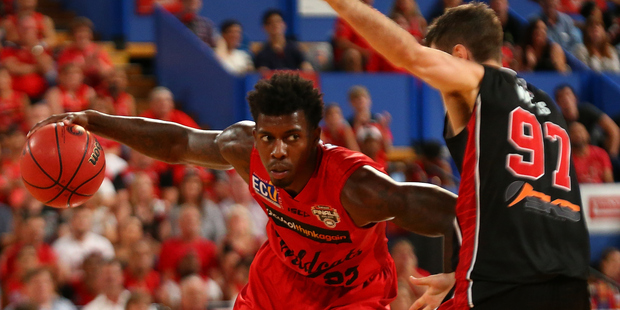 Casey Prather of the Wildcats drives past Jarrad Weeks of the Hawks. Photo/Getty.