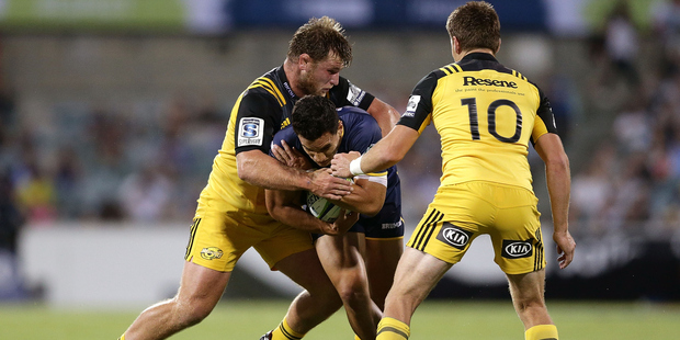 Brumbies playmaker Matt Toomua looks to get past the Hurricanes defence. Photo/Getty.