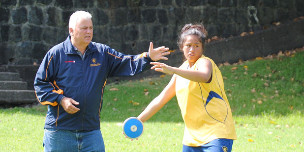Nigel Edwards gives some discus throwing tips to the promising Talia Kahui AT AGGS throwing academy.