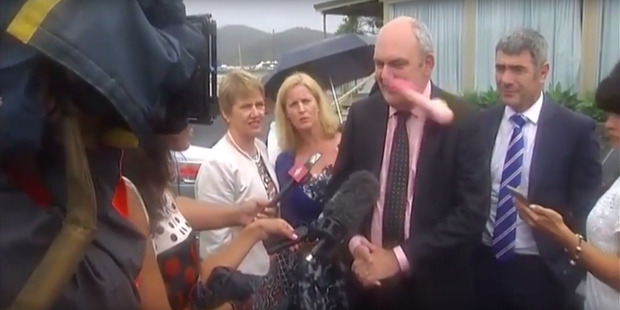 Government minister Steven Joyce is hit in the face by a pink dildo thrown at him in Waitangi. Photo / Newshub