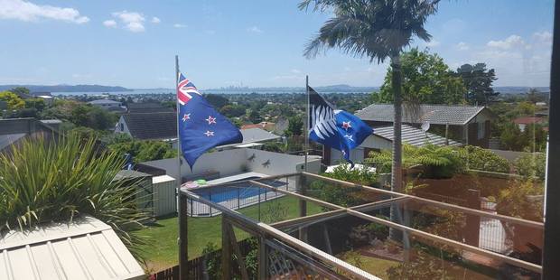 Flags flying in a Massey garden. Photo / Facebook
