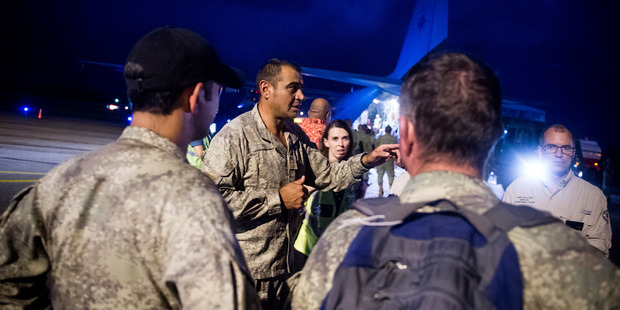 Aid supplies are unloaded from an RNZAF C-130 Hercules in Suva, Fiji. Photo / Supplied