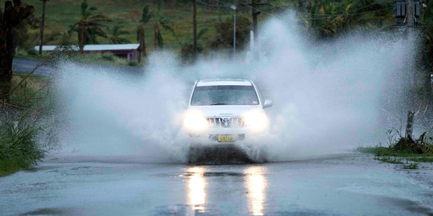 A 4WD drives through flood waters after cyclone Winston hit Fiji caused loss of lives and extensive damage to the north west side of the Viti Levu in Fiji. Photo / Brett Phibbs