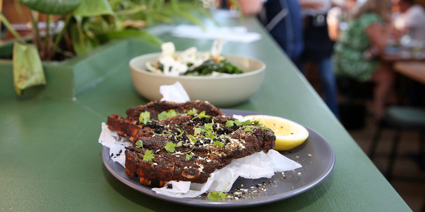 North African spiced lamb chops and wilted silverbeet salad. Photo / Fiona Goodall