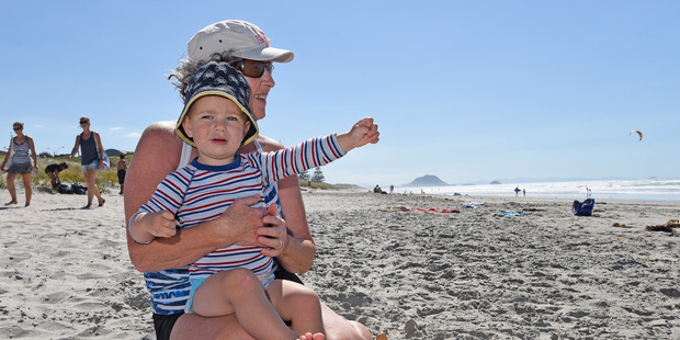 Michela Avent enjoys the beach with her grandson Christian Palmer, 2.Photo/George Novak