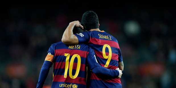 FC Barcelona's Luis Suarez, right, is congratulated by his teammate Messi. Photo / AP.