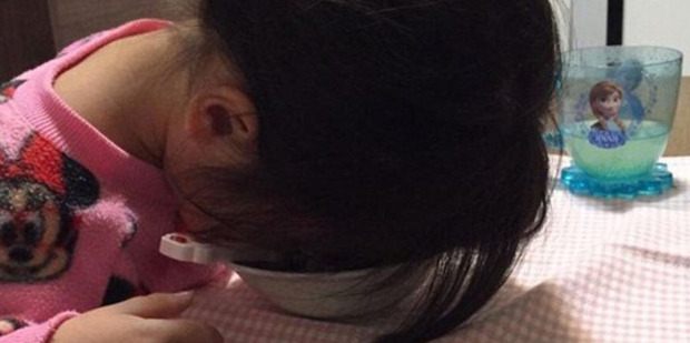 This toddler was far too tired to finish her meal. Or find a better place to rest her head. Photo / Twitter