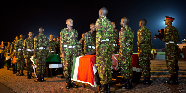 Military pallbearers stand to attention next to coffins of Kenyan soldiers who were killed in Somalia. Photo / AP