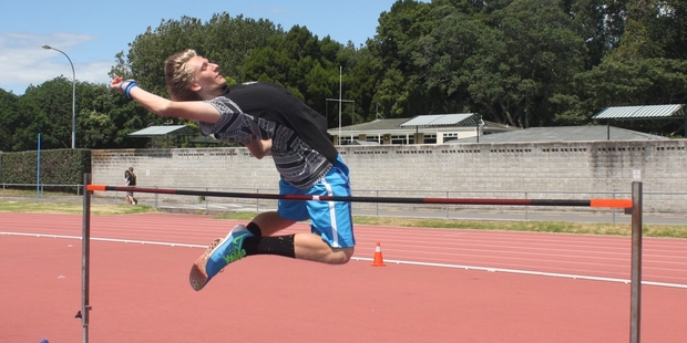 Action from the boys' intermediate high jump competition.