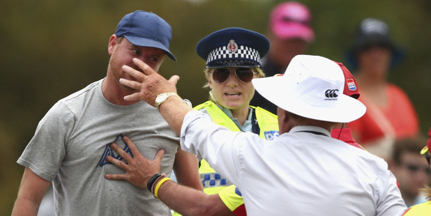 Security detain a spectator at Hagley Oval. Photo / Getty