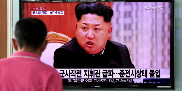 A man looks at a television screen showing an image of Kim Jong Un, leader of North Korea, during a news broadcast. Photo / SeongJoon Cho, Bloomberg