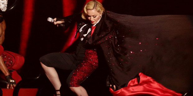 Madonna takes a stumble down stairs whilst performing on stage, during the 2015 Brit Awards at the O2 Arena, London.