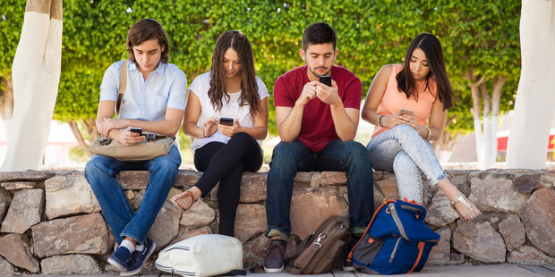 Australian research suggests as many as three in five people check work emails while on holiday. Picture / Getty.