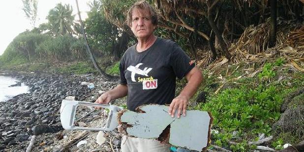 Independent MH370 investigator Blaine Alan Gibson with debris discovered on Riake Beach, Madagascar. Photo / Facebook