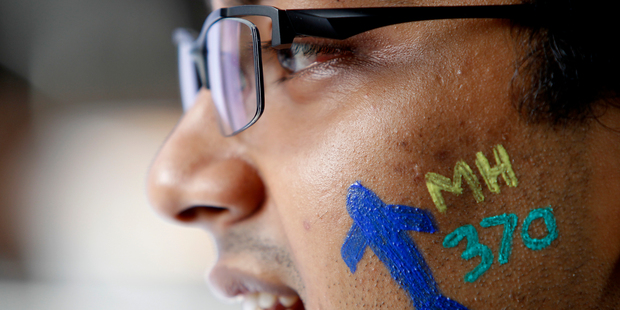 A man attends the Day of Remembrance for MH370 event in Kuala Lumpur, Malaysia. Photos / AP