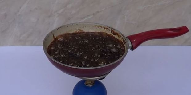 After the water boils off, this is what's left of a bottle of Coke. Photo / YouTube, Home Science