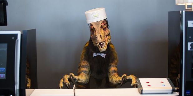 In July 2015 Huis Ten Bosch launched the Henn na Hotel, which translates in English to Weird Hotel, and is almost entirely staffed by robots - including a dinosaur. Photo / Getty Image