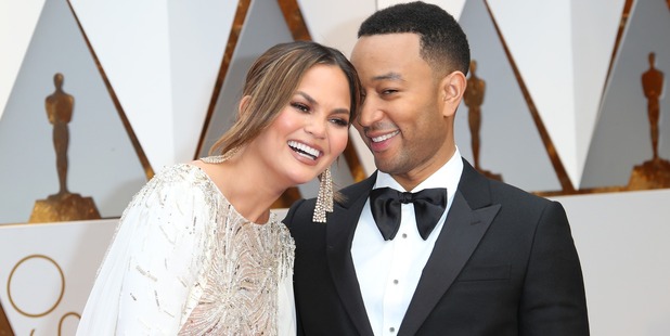 Model Chrissy Teigen (L) and musician and husband John Legend. Photo / Getty