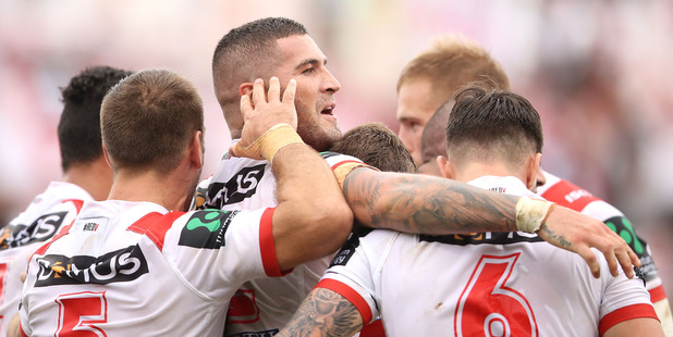 Joel Thompson of the Dragons celebrates with his team mates after scoring a try. Photo / Getty Images