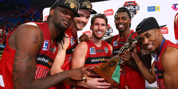 Jameel McKay, Angus Brandt, Damian Martin, Casey Prather and Bryce Cotton of the Wildcats pose with the trophy. Photo / Getty