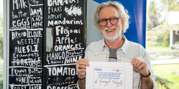 Artist Dick Frizzell shows off one of the Haier fridges he has decorated for charity. Photo / Supplied