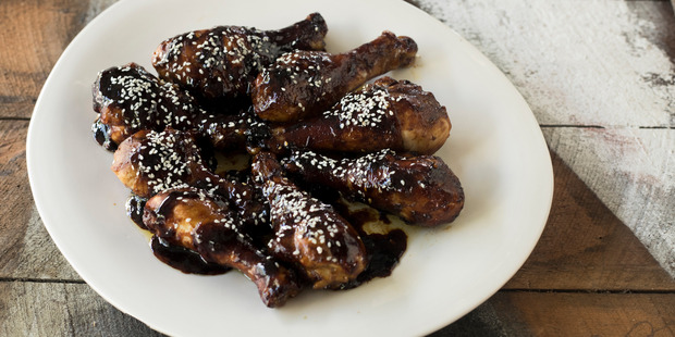Sticky orange sesame drumsticks. Photo / Dean Purcell