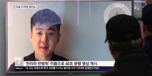 People at a railway station in Seoul, South Korea, watch a TV news programme featuring Kim Han-sol. Photo / AP