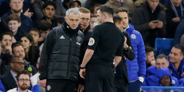 Manchester United's manager Jose Mourinho talks with referee Michael Oliver. Photo / AP