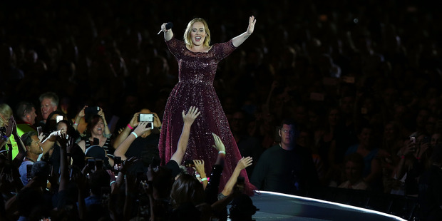 Adele walks the outer-ring of her stage. Photo / Getty Images