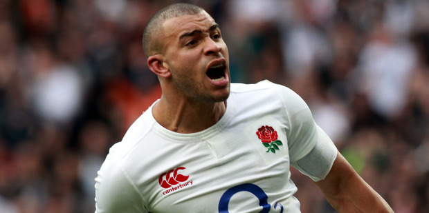 Jonathan Joseph celebrates scoring his second try for England in their Six Nations match against Scotland at Twickenham in London yesterday. Photo / Getty Images.