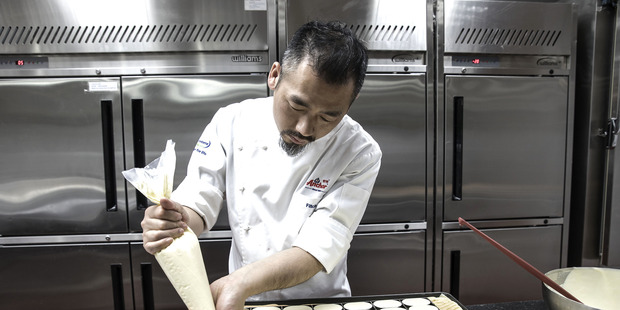 A chef learns to use milk products at an industrial kitchen run by Fonterra in Shanghai. Photo / Bloomberg