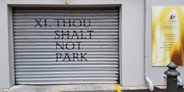 Spotted on a garage next to St John's Presbyterian Church in Willis St, Wellington. Photo / Supplied