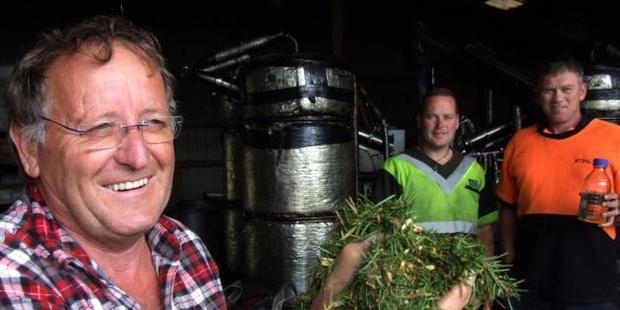 Paul Greaves (left), with son Jared Greaves and Steve Johnson, while distilling Douglas fir into essential oils in 2015. Photo/Sally Rae