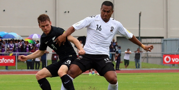 All White Michael McGlinchey (left) battles for possession with Fiji's Peniame Drova in Lautoka yesterday. Photo / OFC Media