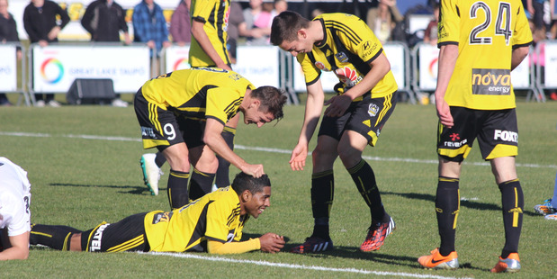 Wellington Phoenix team members congratulate Roy Krishna. Photo / Rory Scott