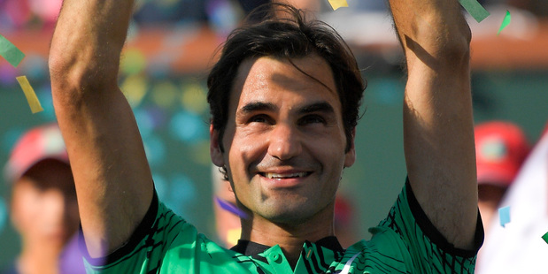 Roger Federer celebrates his 6-4, 7-5 win over Stan Wawrinka in the men's final of the BNP Paribas Open tennis tournament in Indian Wells, California, USA. Photo / AP.
